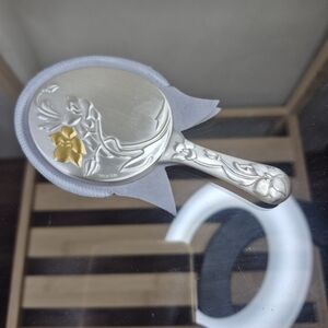 Elegant Silver Hand Mirror with Gold Floral Detail